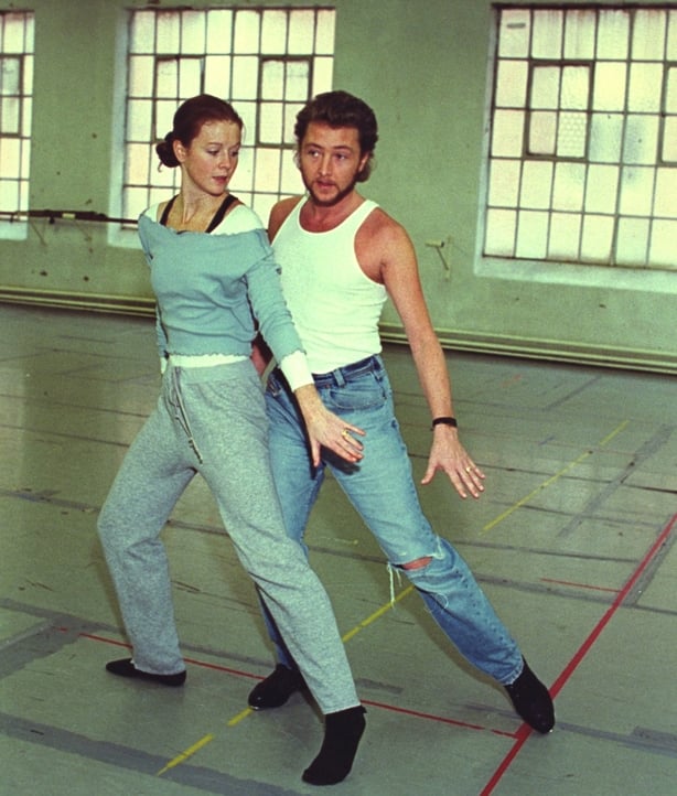 Jean Butler and Michael Flatley rehearsing, their legs and shoes visible